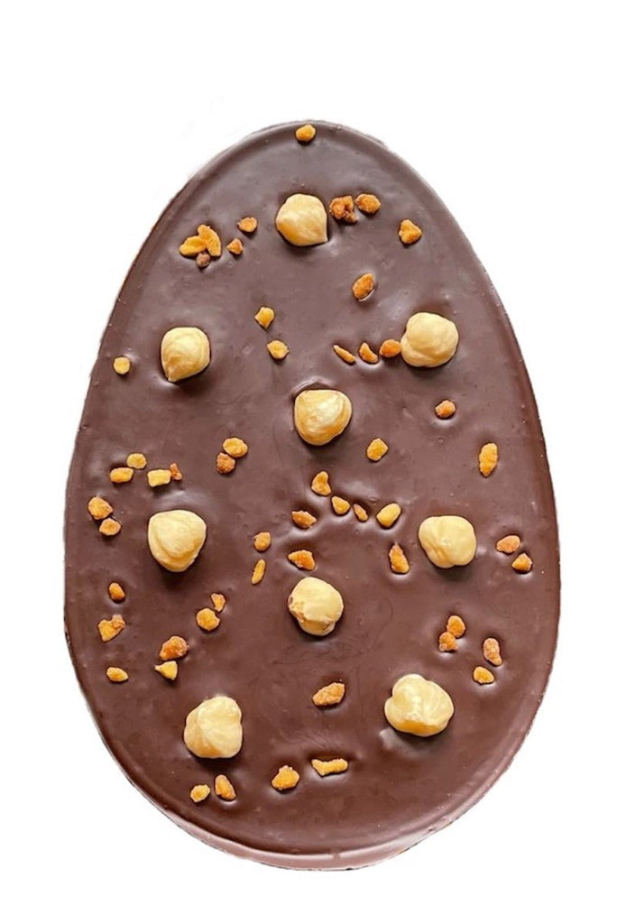 Go Nuts dark chocolate easter egg shaped bar topped with whole hazelnuts and chopped, roasted and caramelised hazelnut pieces.