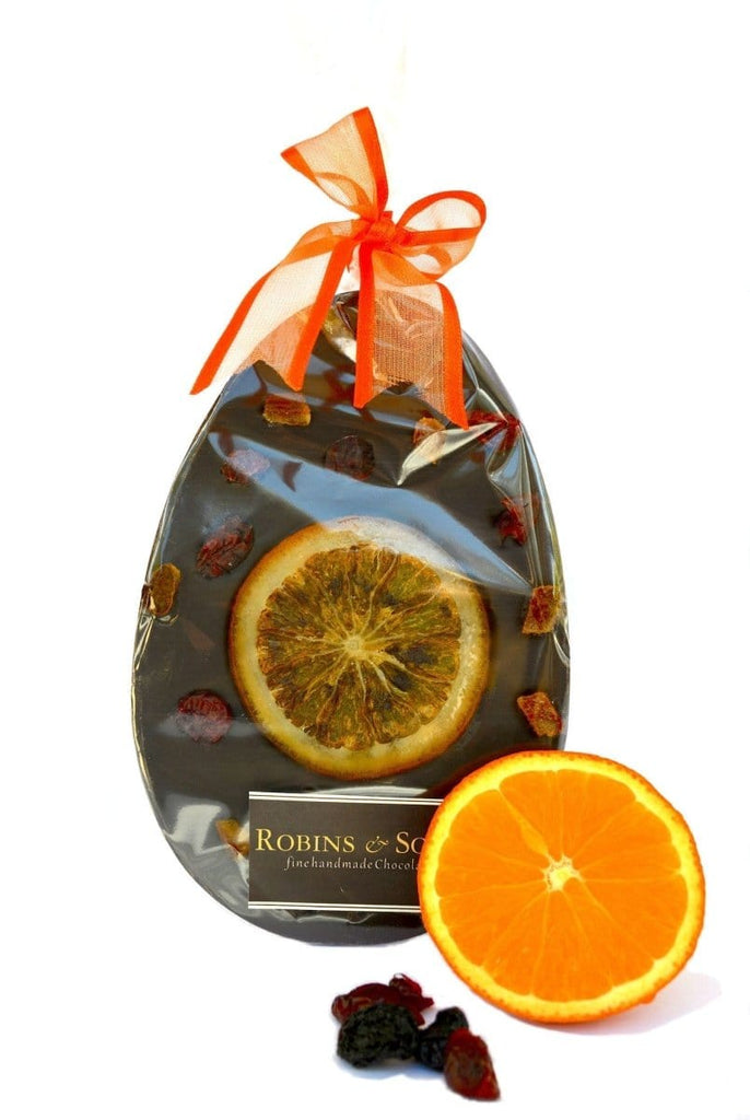 Luxury dark chocolate easter egg bar with whole orange slice and cranberries