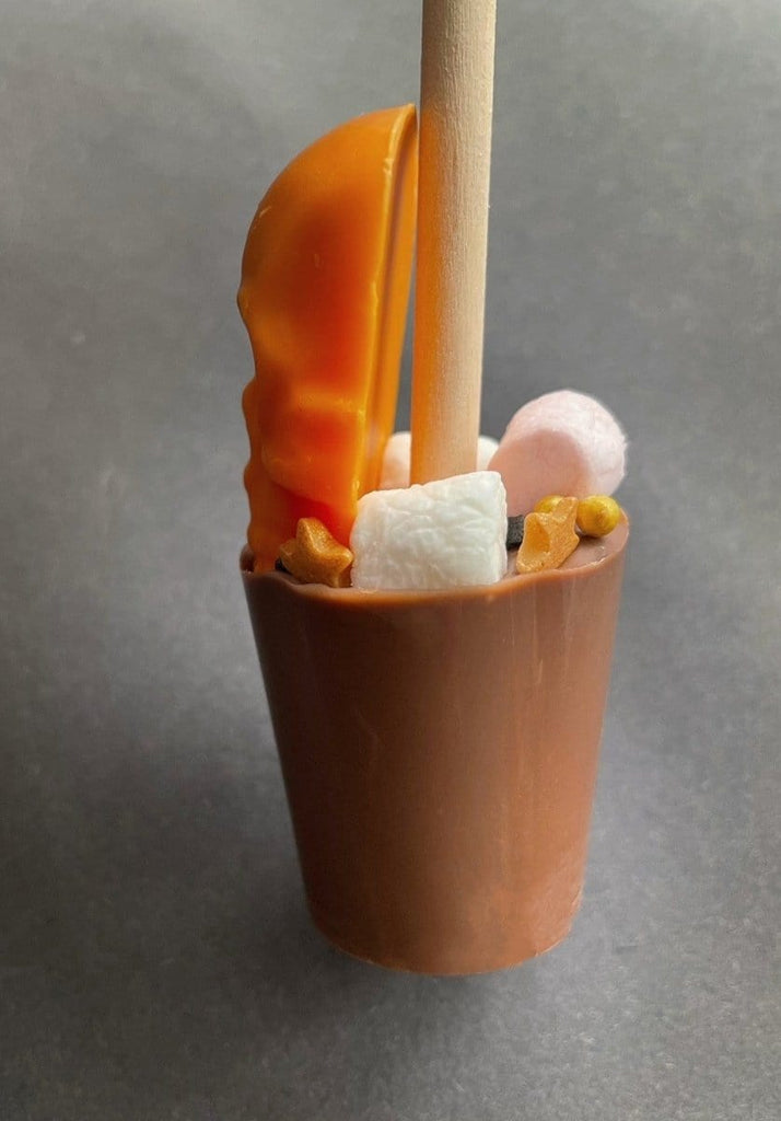 Halloween Skull hot chocolate stirrer toped with marshmallows and halloween sprinkles