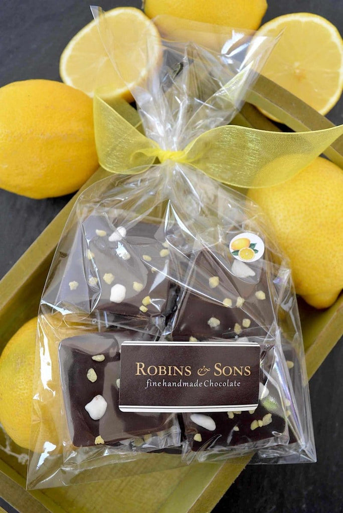 Belgian 70% dark chocolate squares with natural lemon oil and topped with lemon crystals and meringue