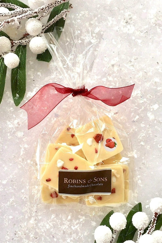 individually wrapped white chocolate squares topped with strawberries