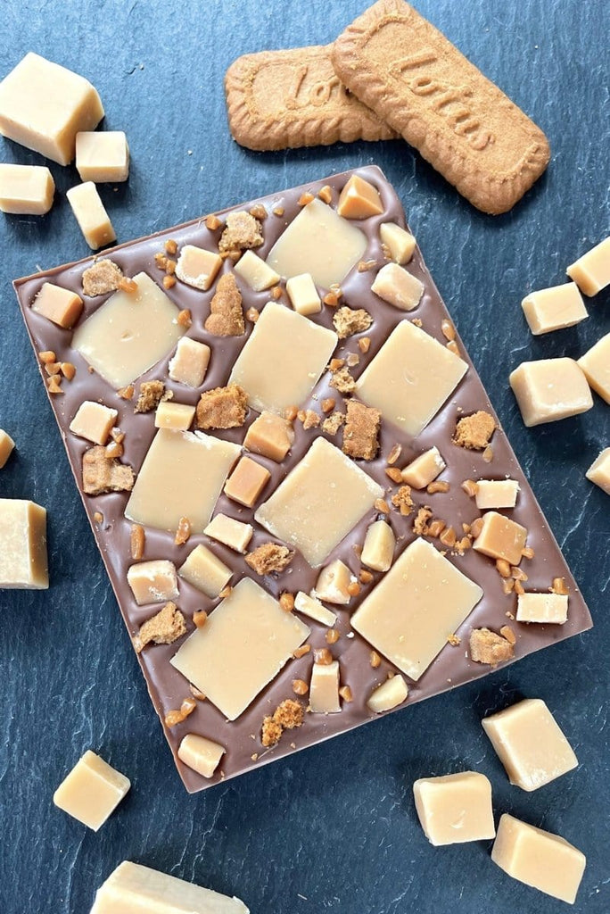 Chunky chocolate slab bar covered with vanilla fudge chunks